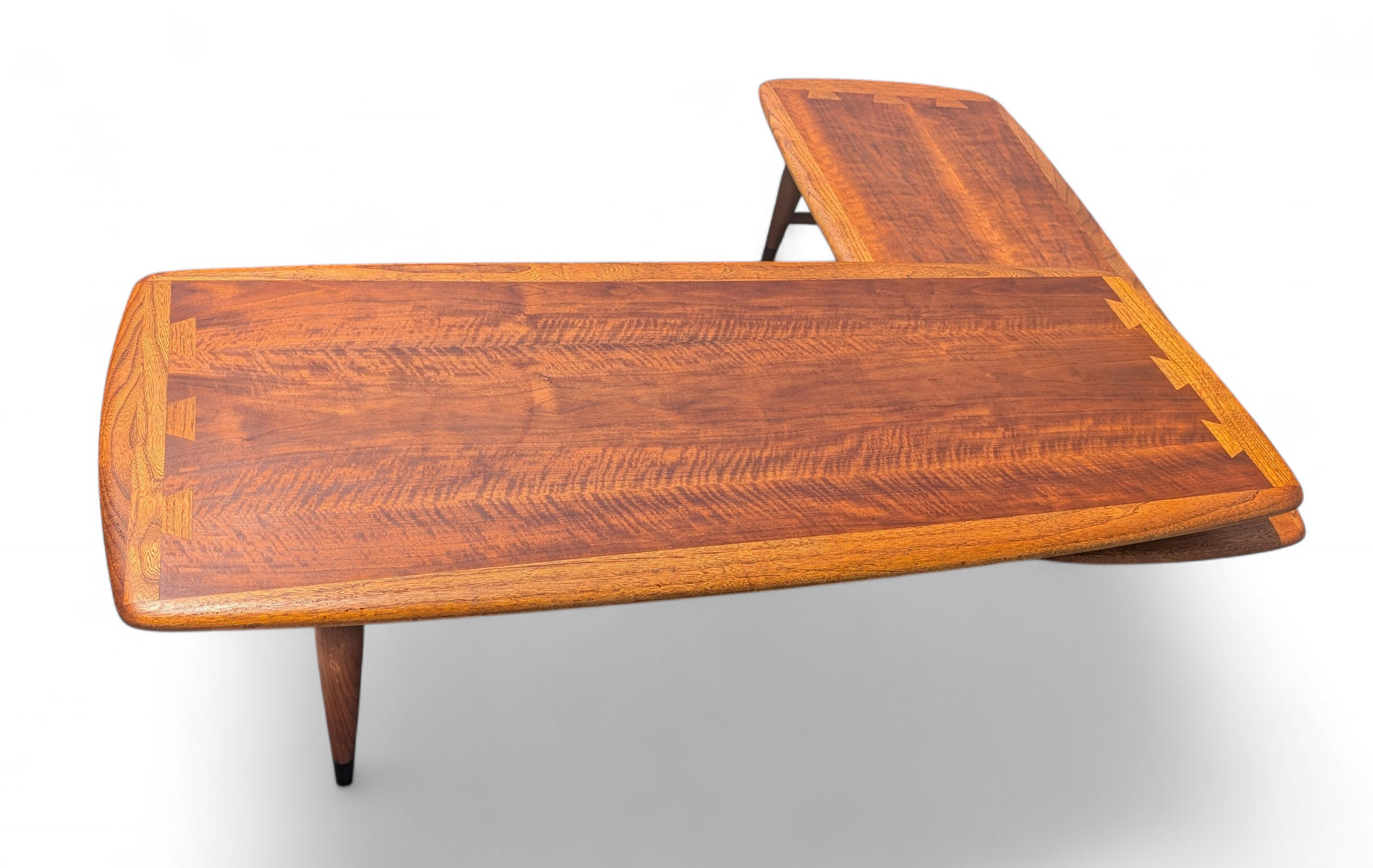 Wooden L-shaped table on a white background